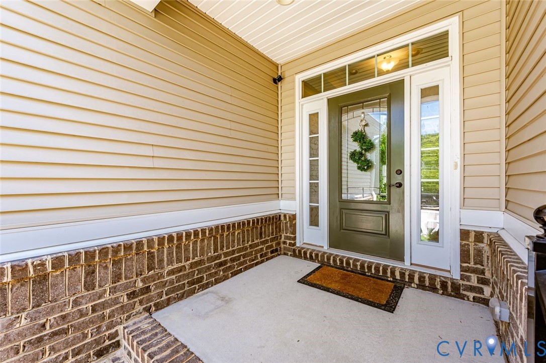7435 Wicks Road Williamsburg, VA 23188 - Photo 8 of 82 Inviting entryway featuring a paneled entry door w
