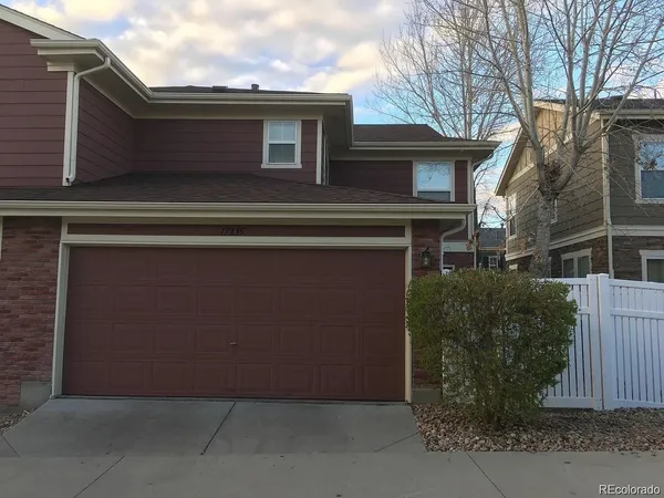 a front view of a house with garage