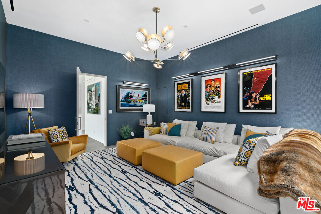 1550 Casale Road Pacific Palisades, CA 90272 - Photo 15 of 29 a bedroom with furniture and a chandelier