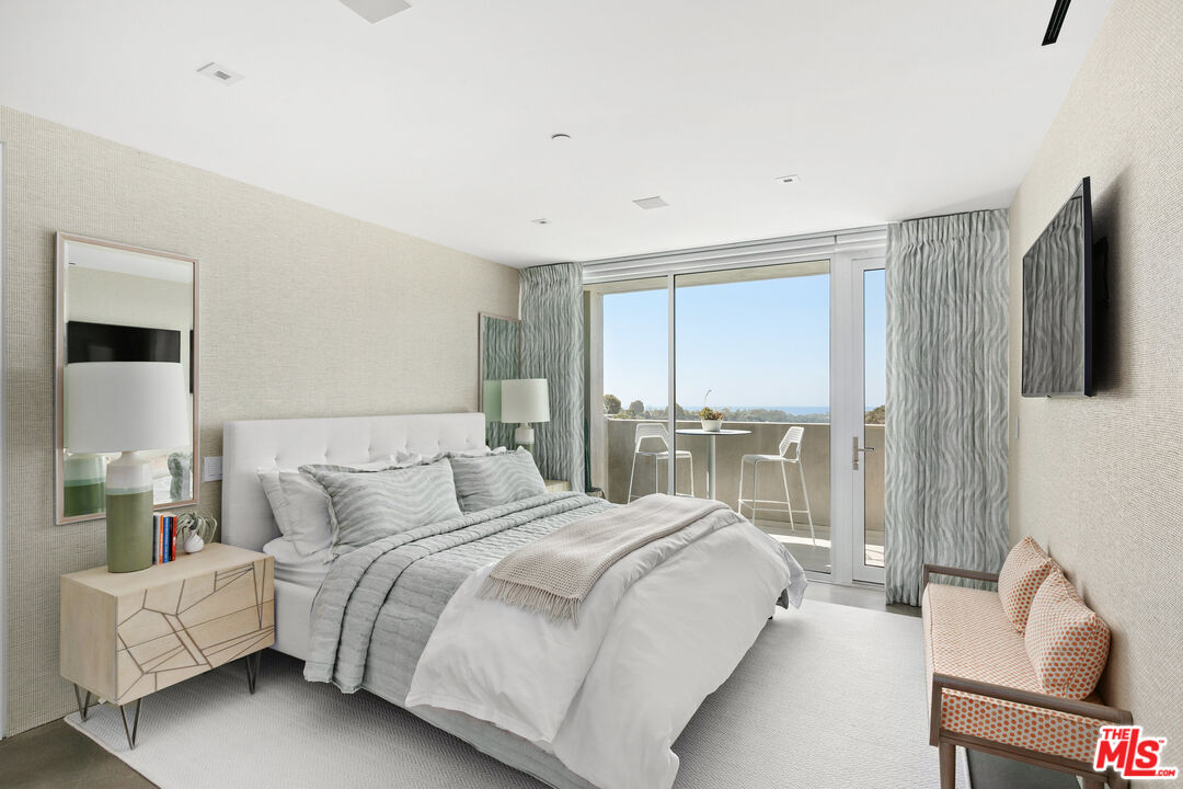 1550 Casale Road Pacific Palisades, CA 90272 - Photo 23 of 29 a bedroom with bed and glass door
