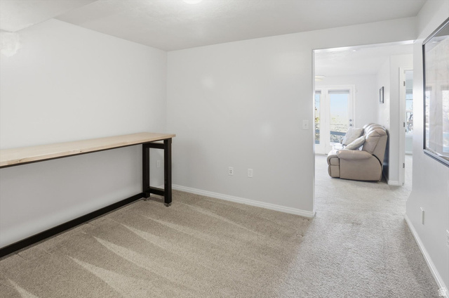 14820 175 East Draper, UT 84020 - Photo 25 of 39 Empty room with light colored carpet and baseboards