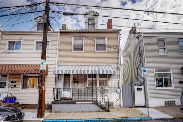 a front view of a house with a garage
