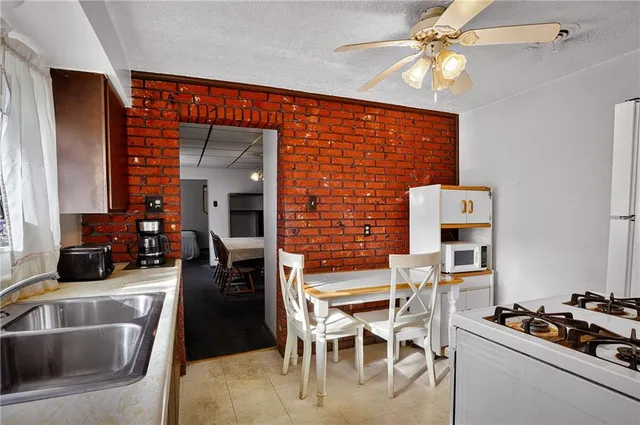 a dining room with furniture and a fireplace