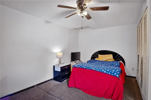 a bedroom with a bed and a mirror