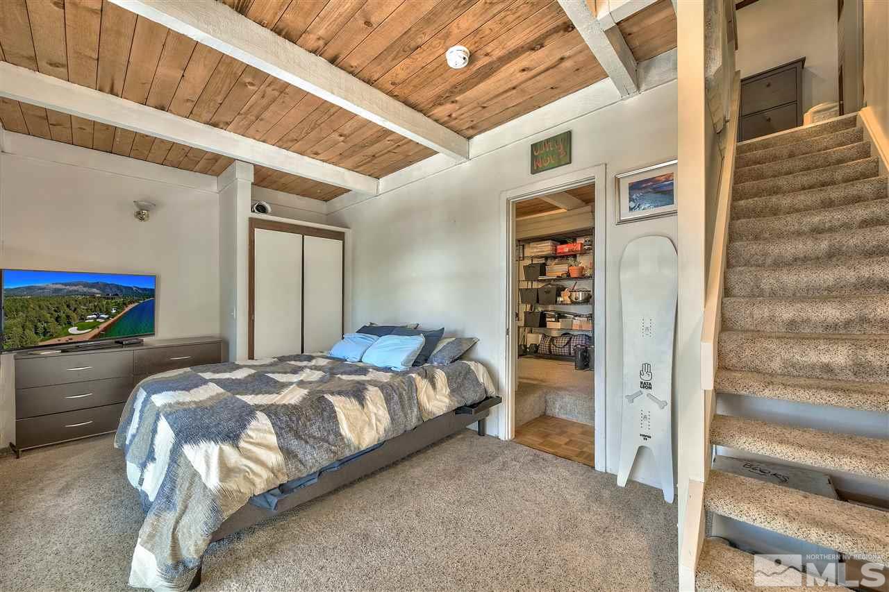 331 Tramway Drive, Unit 4 Stateline, NV 89449 - Photo 11 of 18 a bedroom with a bed and a walk in closet