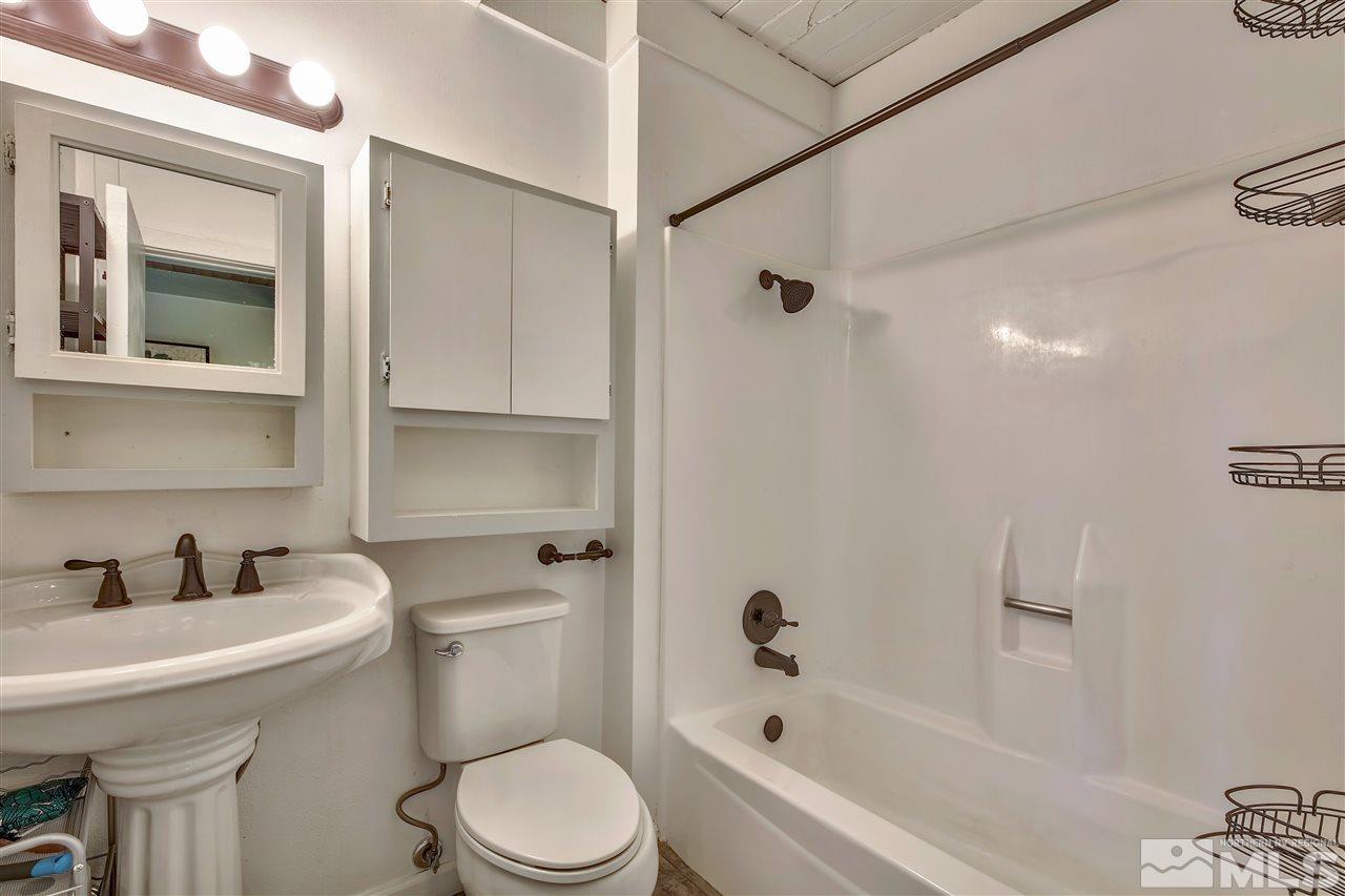 331 Tramway Drive, Unit 4 Stateline, NV 89449 - Photo 12 of 18 a bathroom with a sink toilet and shower