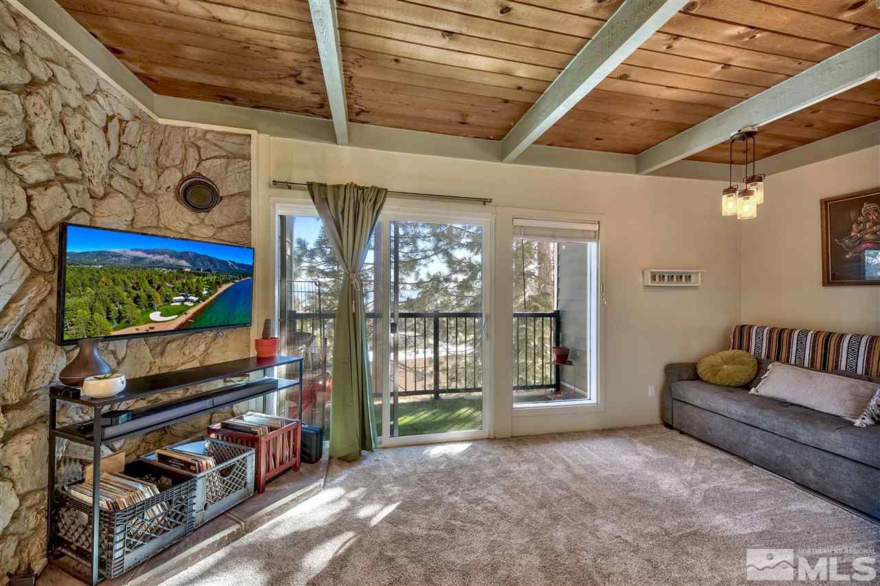 331 Tramway Drive, Unit 4 Stateline, NV 89449 - Photo 4 of 18 a living room with furniture a flat screen tv and a window