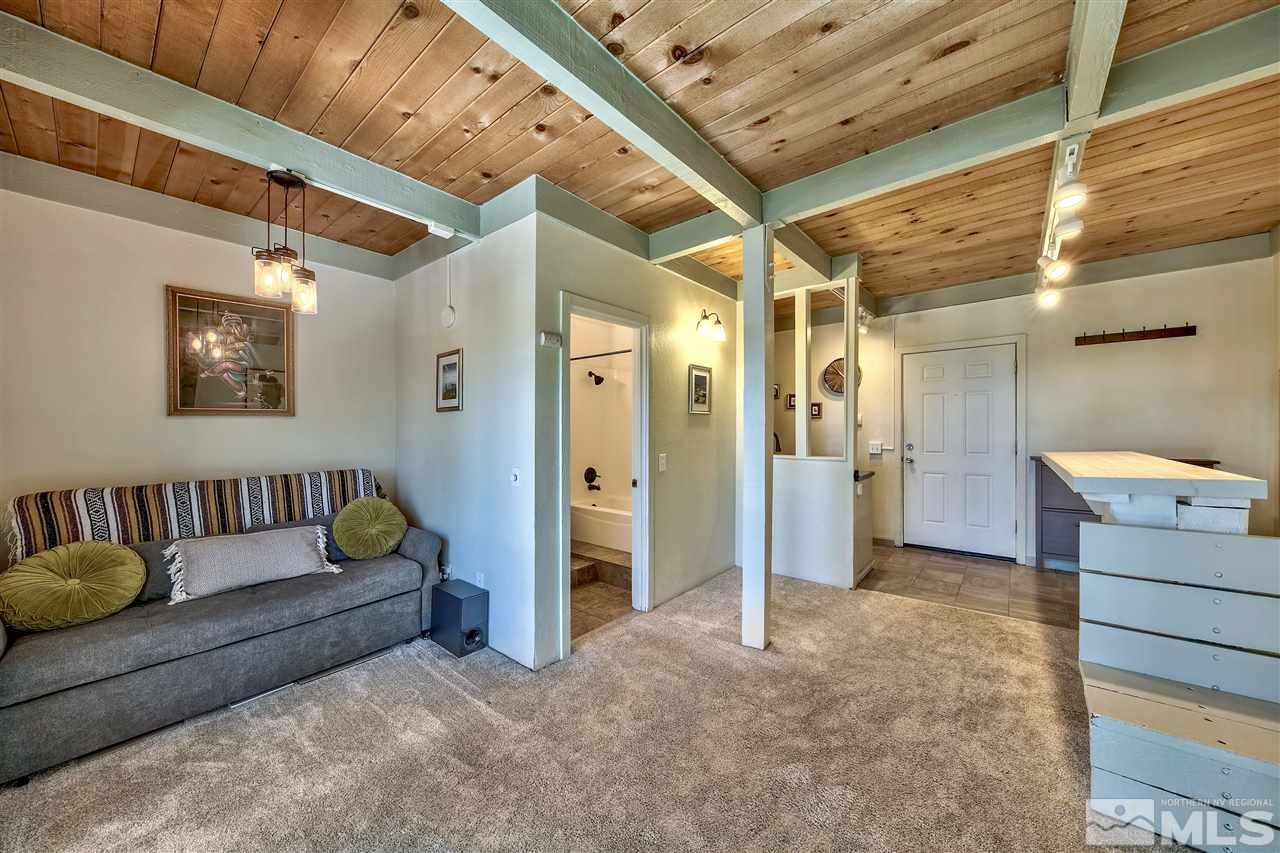 331 Tramway Drive, Unit 4 Stateline, NV 89449 - Photo 7 of 18 a view of livingroom with furniture and windows