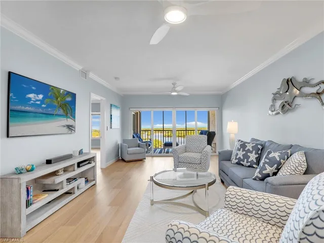 a living room with furniture and a large mirror