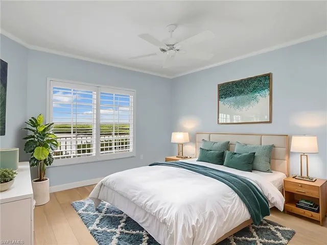 a bedroom with a bed running cycle and a window