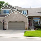 a view of a house with a yard and garage
