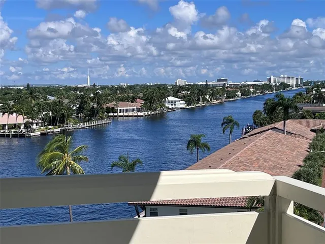 an aerial view of residential houses with city view