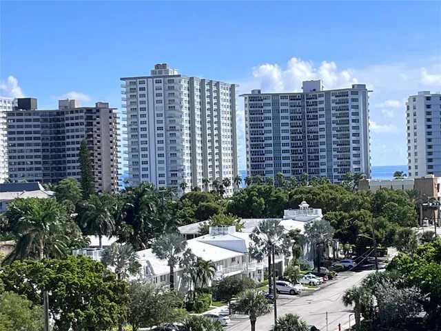 an aerial view of a house with a ocean view