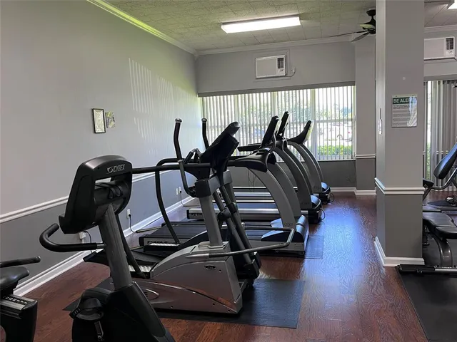 a bedroom with a workspace