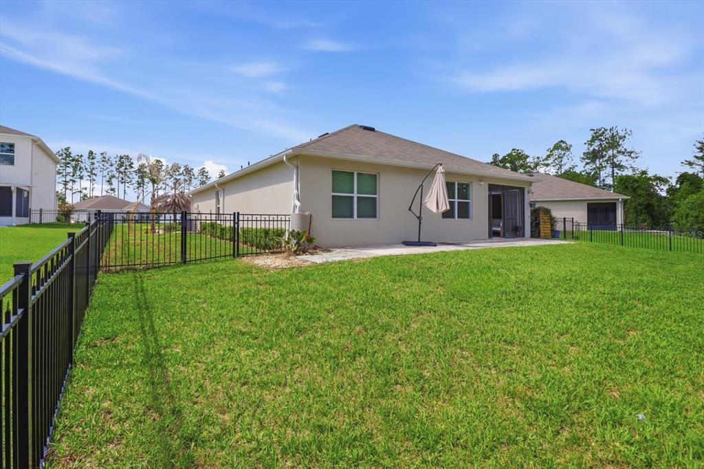660 Hickory Course Loop Ocala, FL 34472 - Photo 40 of 45 a view of a house with a yard and potted plants