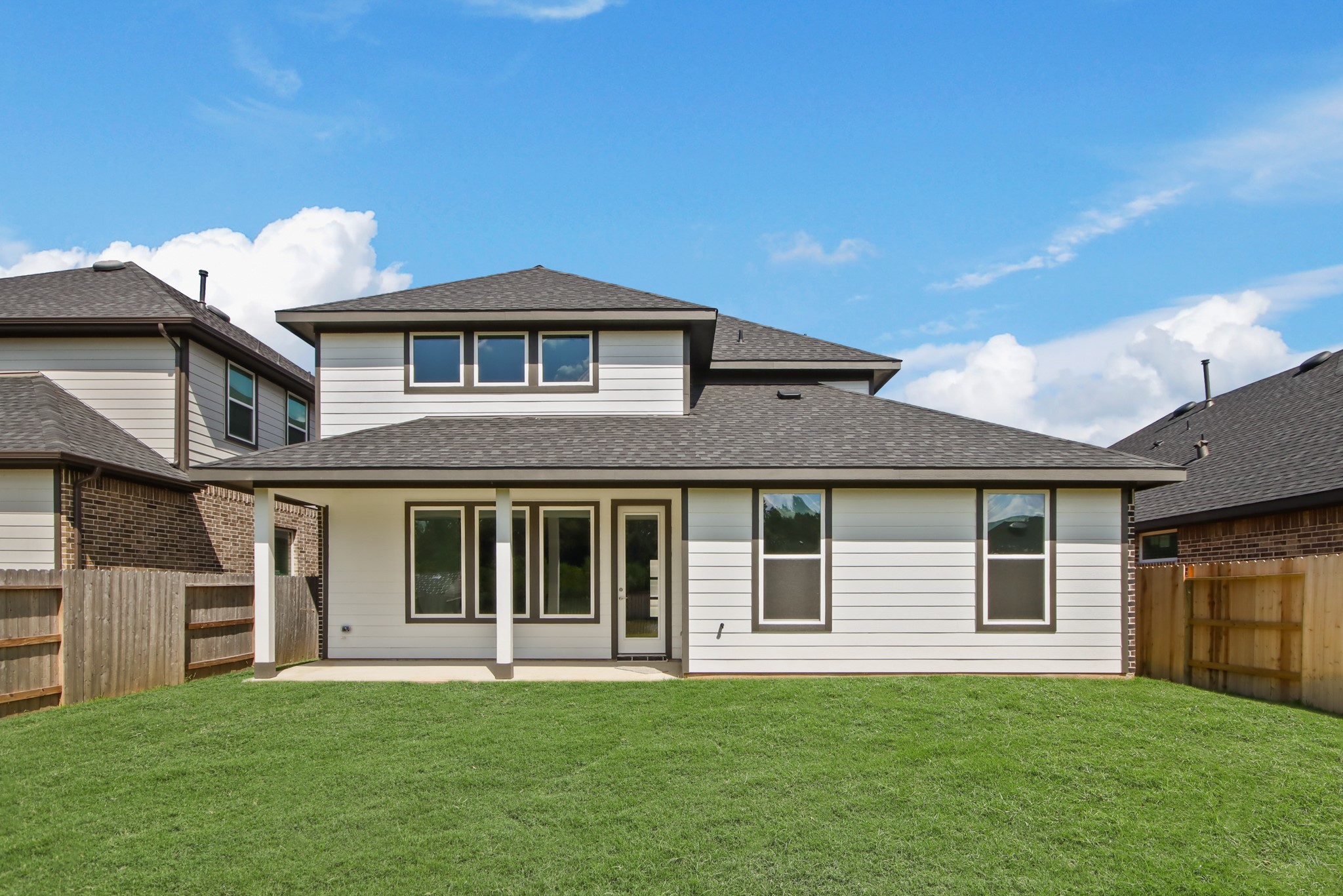 259 Springfield Terrace Drive Conroe, TX 77304 - Photo 6 of 14 a front view of a house with a garden