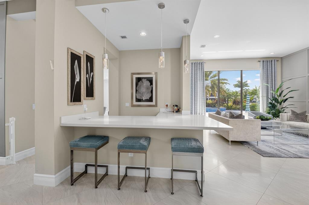 9294 Biaggio Road Boca Raton, FL 33496 - Photo 11 of 80 a living room with furniture and a potted plant