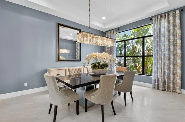 a large kitchen with stainless steel appliances lots of counter space and a sink