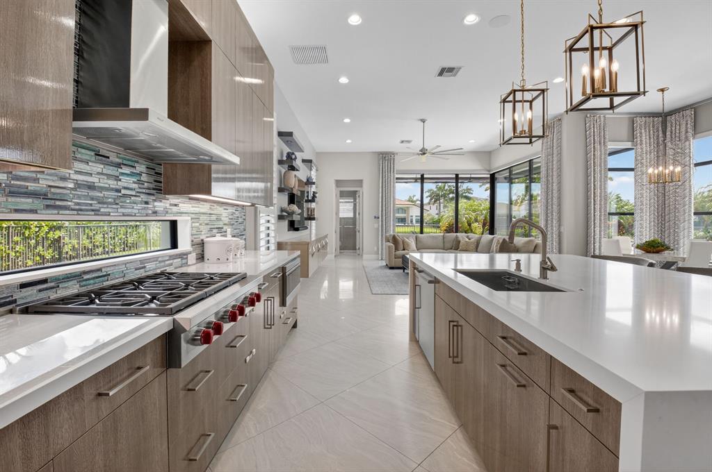 9294 Biaggio Road Boca Raton, FL 33496 - Photo 17 of 80 a kitchen with stainless steel appliances granite countertop a stove and a sink