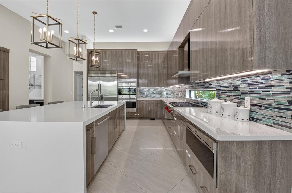 9294 Biaggio Road Boca Raton, FL 33496 - Photo 18 of 80 a large kitchen with stainless steel appliances lots of counter space and a sink