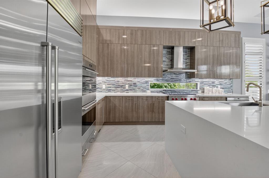 9294 Biaggio Road Boca Raton, FL 33496 - Photo 20 of 80 a kitchen with stainless steel appliances granite countertop a sink and a refrigerator