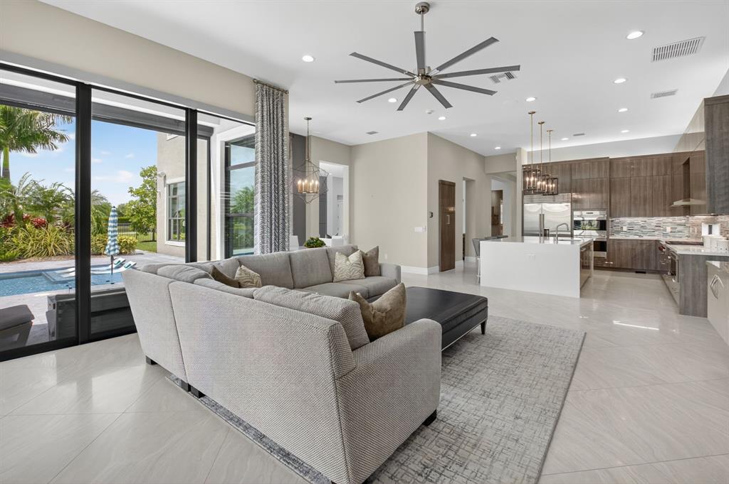 9294 Biaggio Road Boca Raton, FL 33496 - Photo 26 of 80 a living room with furniture and a large window