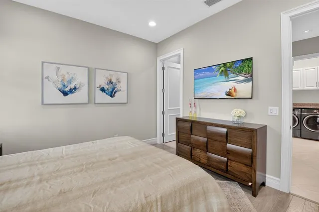 a living room with furniture a large window and flat screen tv