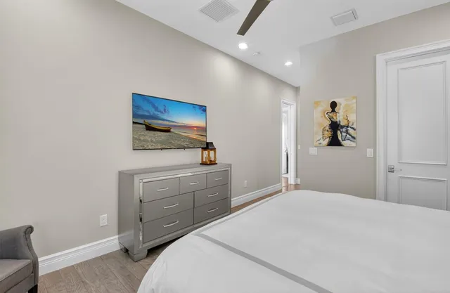 an aerial view of a house with swimming pool outdoor seating and yard