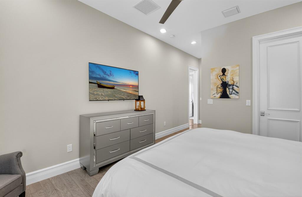 9294 Biaggio Road Boca Raton, FL 33496 - Photo 36 of 80 a bedroom with a bed and a dresser