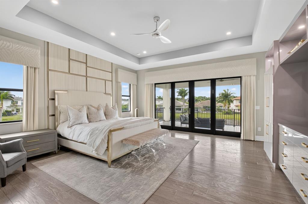 9294 Biaggio Road Boca Raton, FL 33496 - Photo 43 of 80 a spacious bedroom with a large bed and a large window