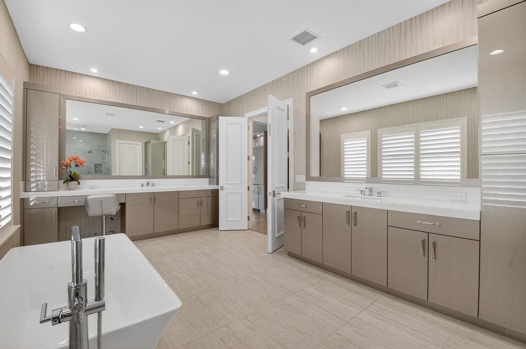 9294 Biaggio Road Boca Raton, FL 33496 - Photo 48 of 80 a large bathroom with a double vanity sink a mirror and a bathtub