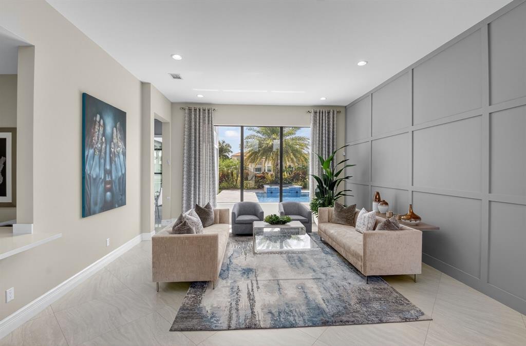 9294 Biaggio Road Boca Raton, FL 33496 - Photo 6 of 80 a living room with furniture and a potted plant