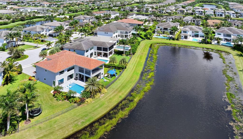 9294 Biaggio Road Boca Raton, FL 33496 - Photo 70 of 80 an aerial view of a house with a garden and lake view