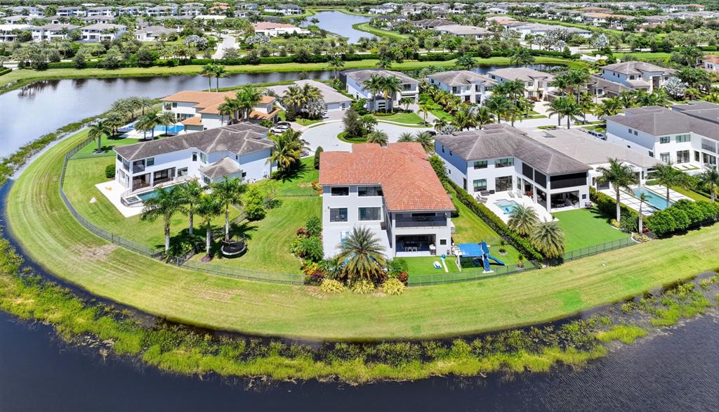 9294 Biaggio Road Boca Raton, FL 33496 - Photo 71 of 80 an aerial view of residential houses with outdoor space and lake view