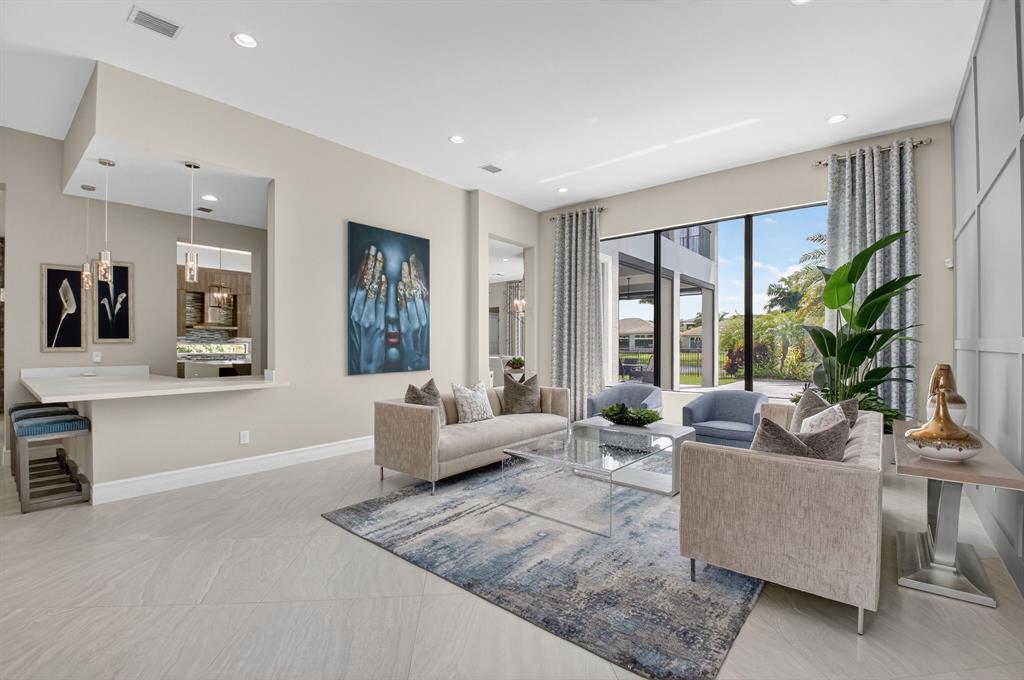 9294 Biaggio Road Boca Raton, FL 33496 - Photo 8 of 80 a living room with furniture and a large window