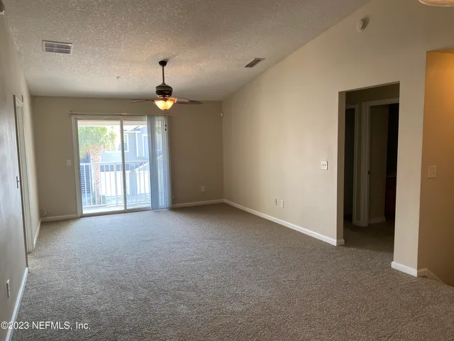 a view of empty room with windows