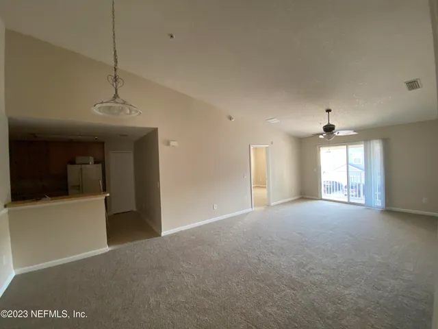 a view of empty room with windows