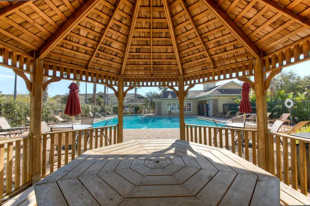 a work room with furniture and floor to ceiling window