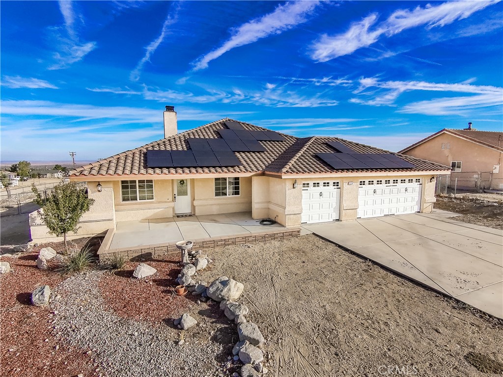 1118 Smoke Tree Road Pinon Hills, CA 92372 - Photo 1 of 1 a view of a house with a yard