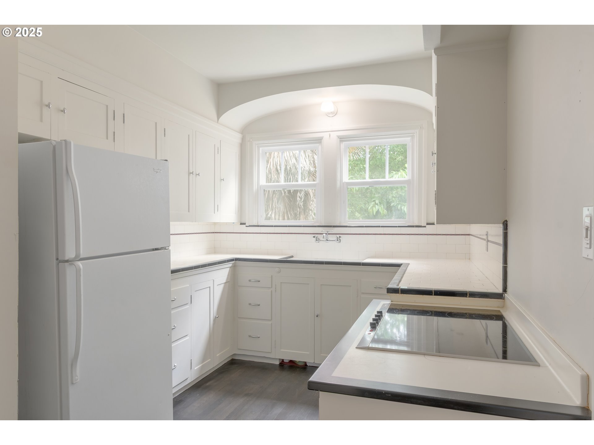 960 Washington Street Eugene, OR 97401 - Photo 18 of 43 a kitchen with a window sink and refrigerator