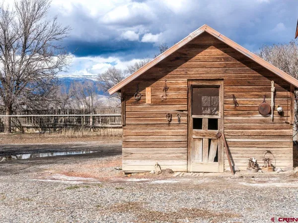 a kitchen with stainless steel appliances a stove a sink and a refrigerator