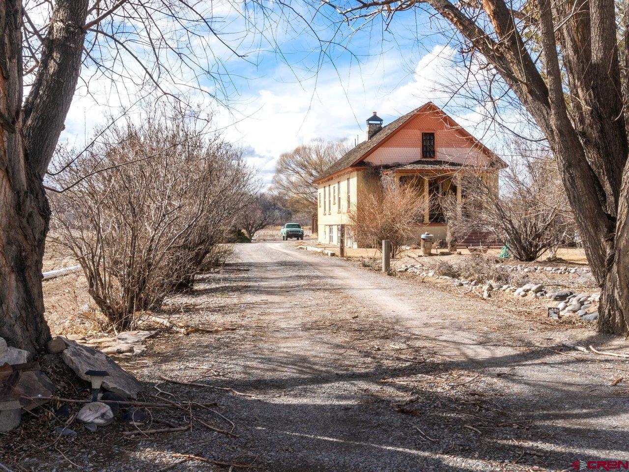 477 1600 Road Delta, CO 81416 - Photo 2 of 23 a view of a house with a yard