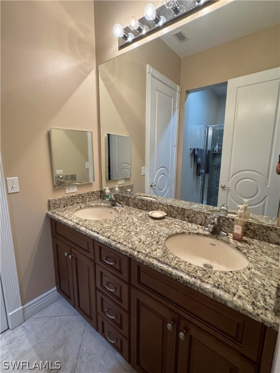 2408 River Way LaBelle, FL 33935 - Photo 11 of 21 a bathroom with a granite countertop sink and a mirror