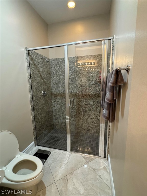 2408 River Way LaBelle, FL 33935 - Photo 12 of 21 a bathroom with a toilet and a shower