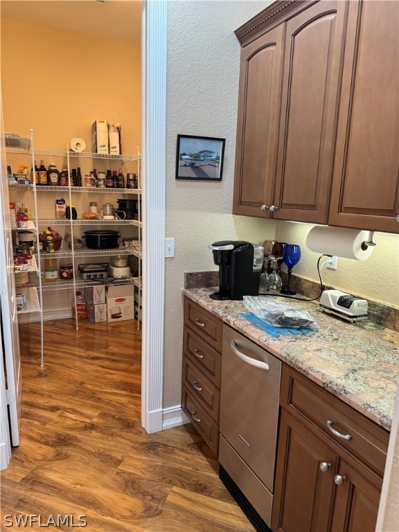 2408 River Way LaBelle, FL 33935 - Photo 14 of 21 a kitchen with granite countertop a sink a stove and cabinets