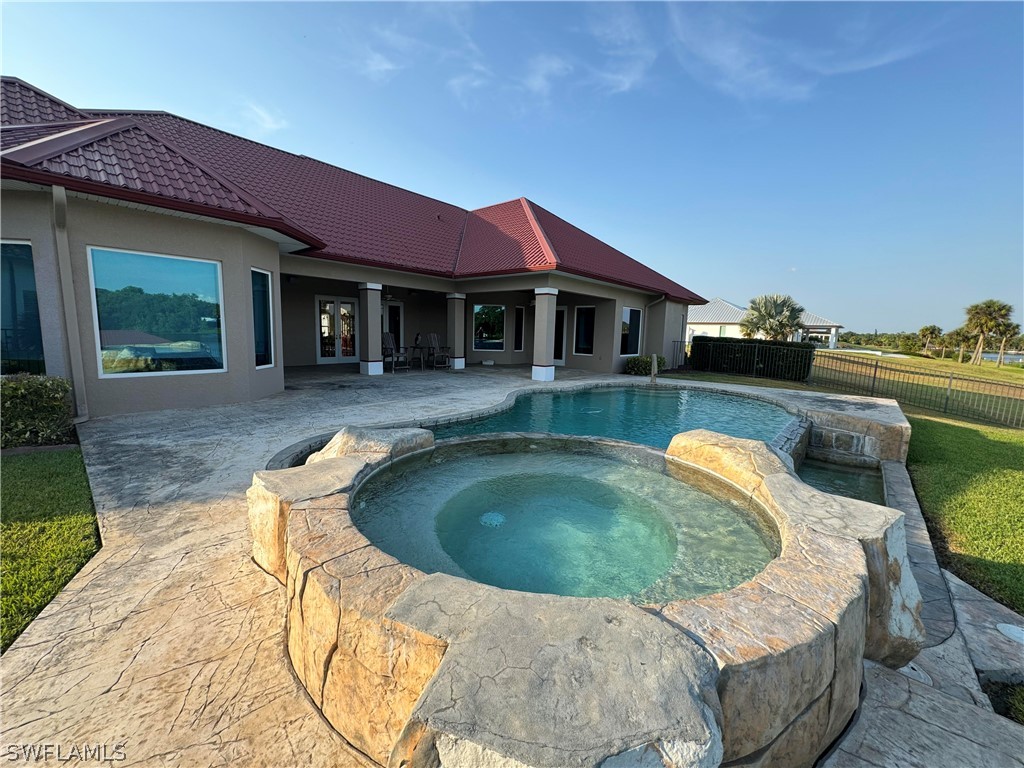 2408 River Way LaBelle, FL 33935 - Photo 20 of 21 a view of a house with swimming pool and sitting area