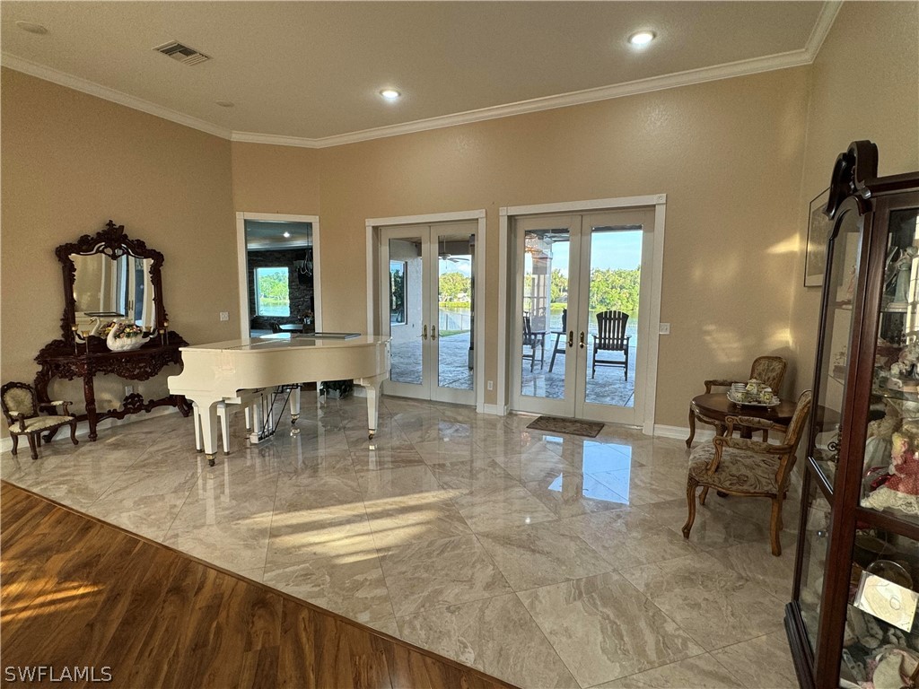 2408 River Way LaBelle, FL 33935 - Photo 2 of 21 a room with lots of chairs and mirrors