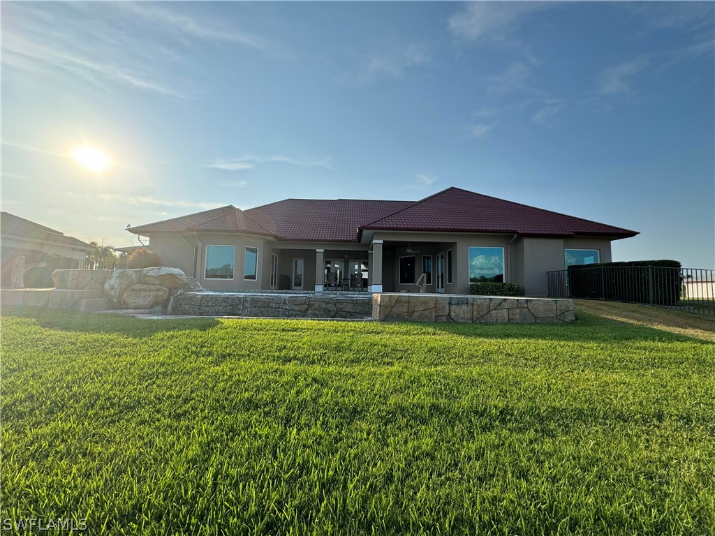2408 River Way LaBelle, FL 33935 - Photo 21 of 21 a front view of a house with a garden