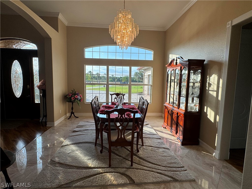 2408 River Way LaBelle, FL 33935 - Photo 3 of 21 a view of a dining room with furniture window and outside view