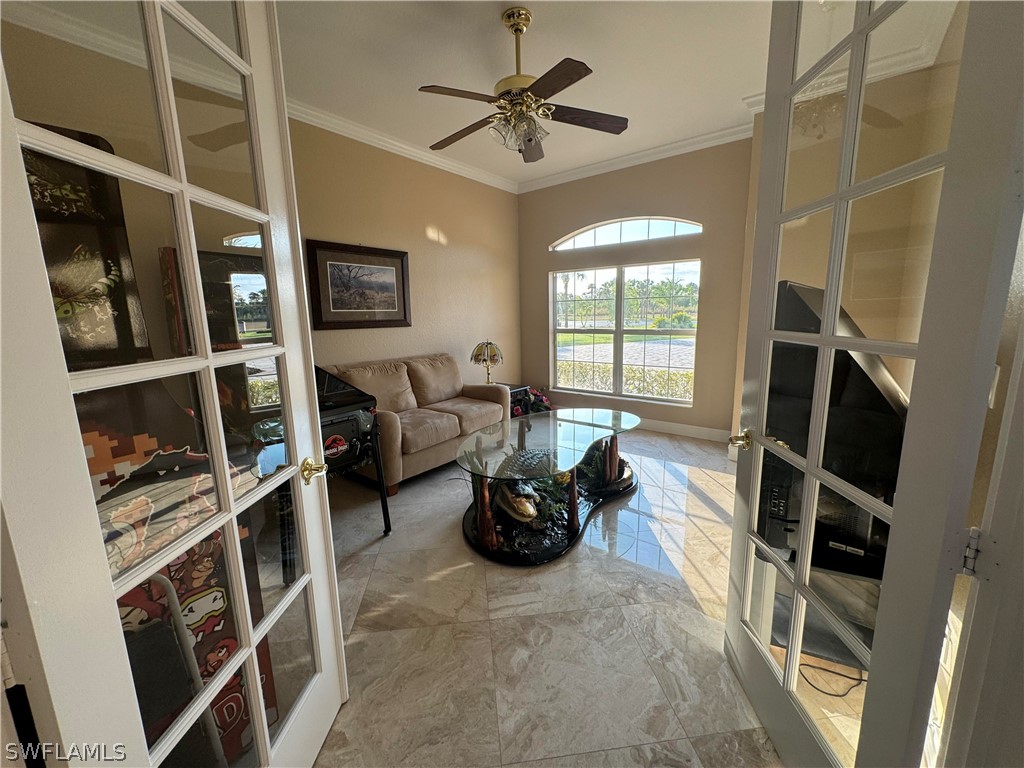 2408 River Way LaBelle, FL 33935 - Photo 4 of 21 a living room with furniture and a book shelf